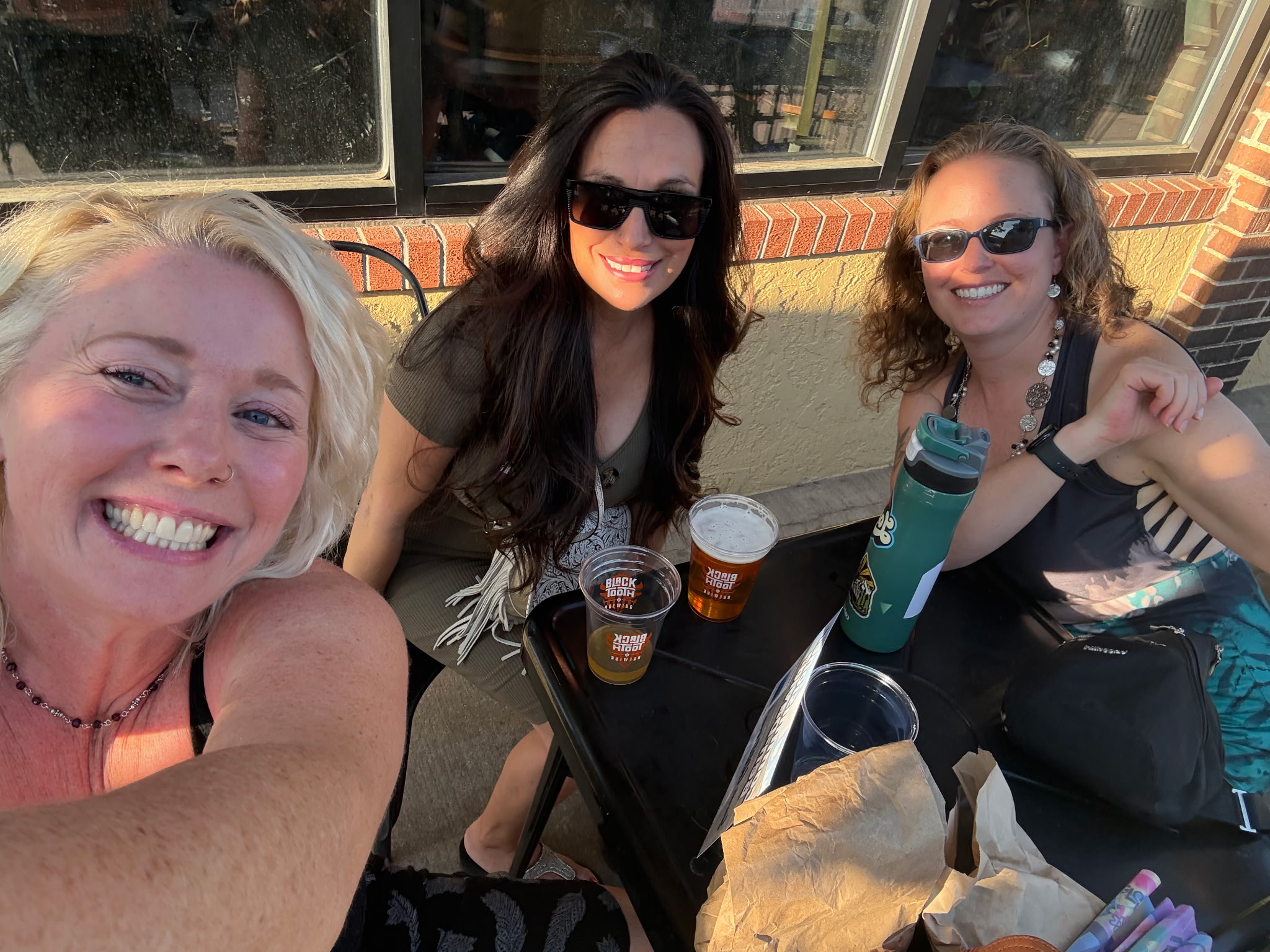 Merissa Martinez visiting with friends at a gathering in downtown Laramie, Wyoming